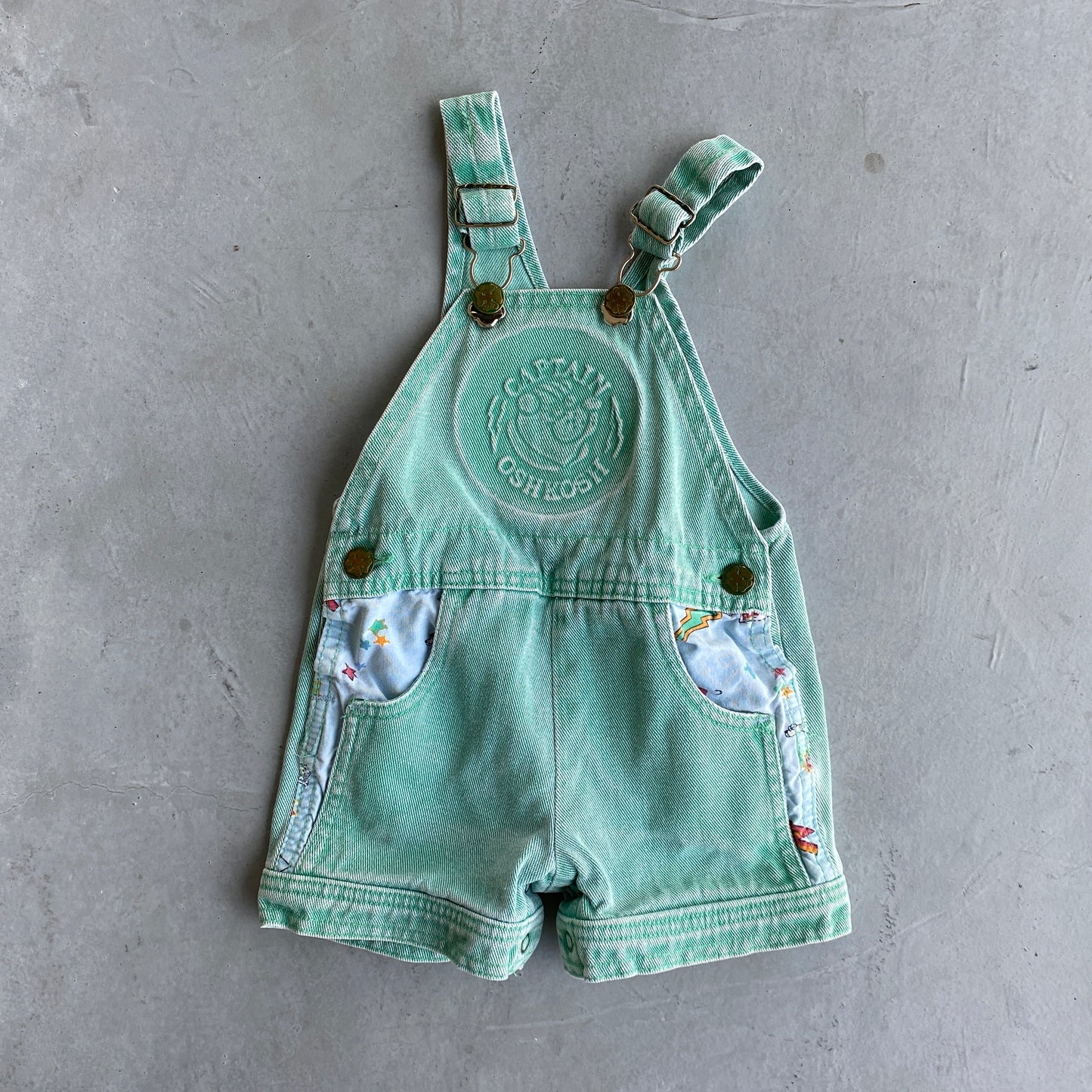 Vintage OshKosh Super Hero Mint Denim Shortalls (18M)
