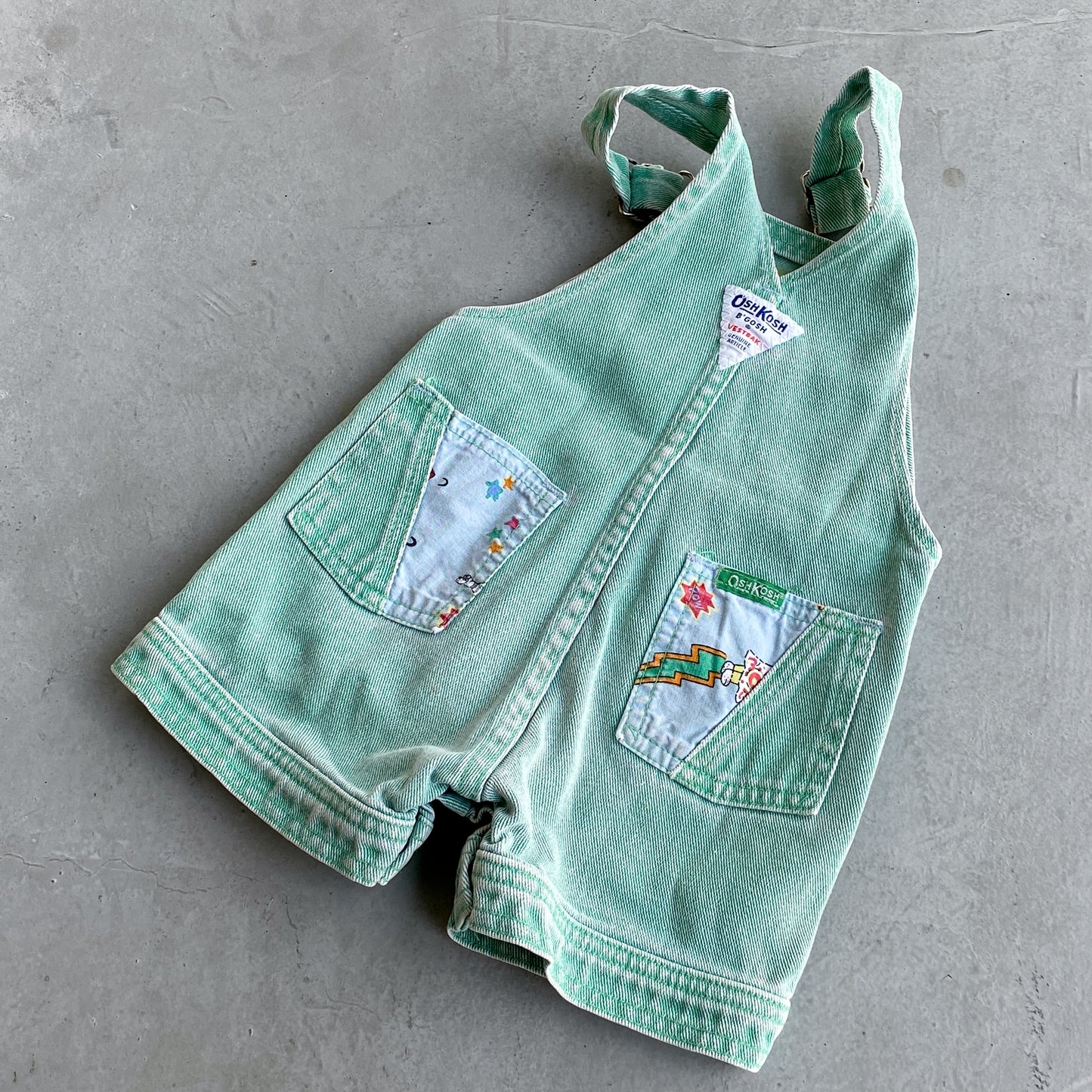 Vintage OshKosh Super Hero Mint Denim Shortalls (18M)